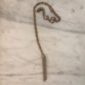 Long gold necklace with diamond pendant